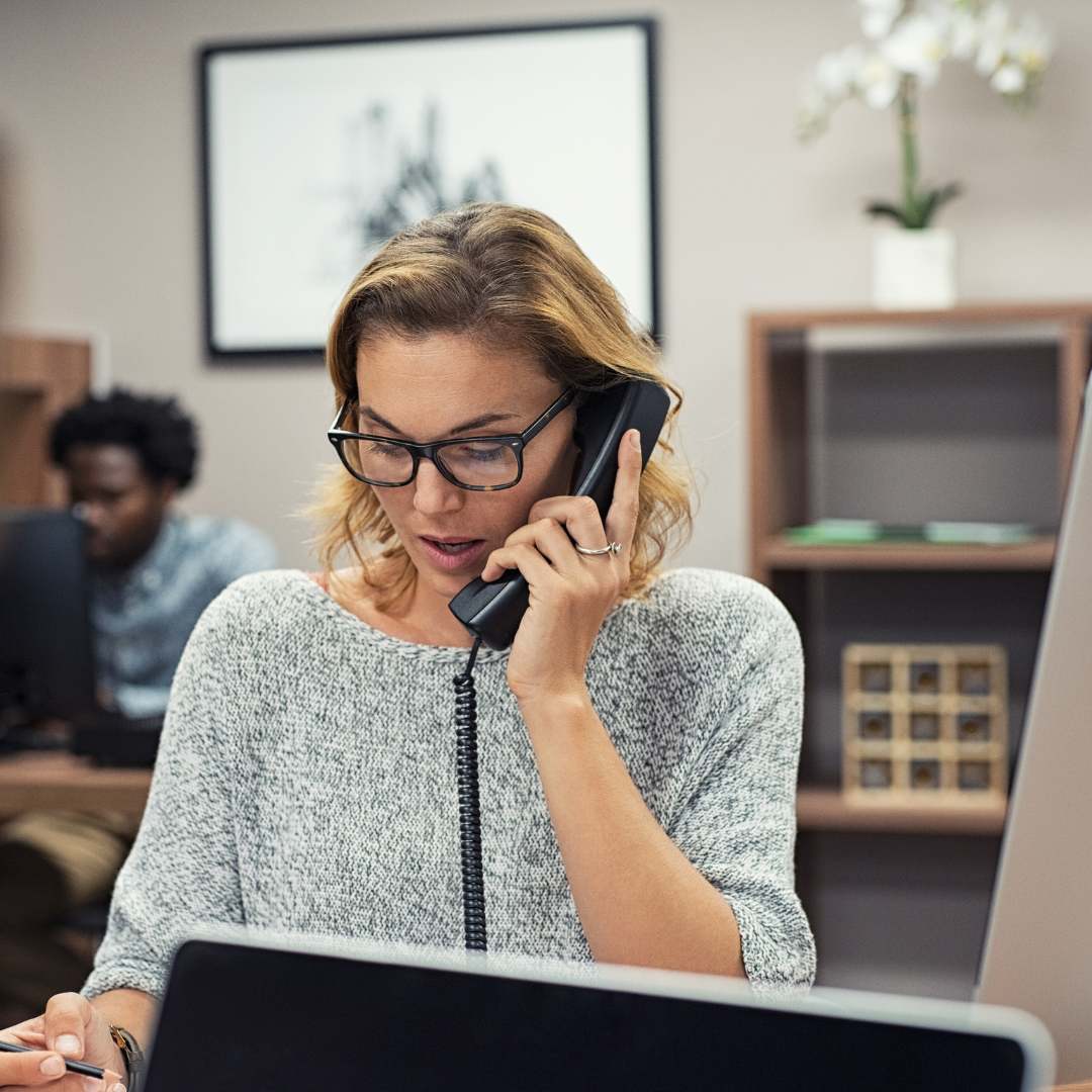 Lady answering call in an office