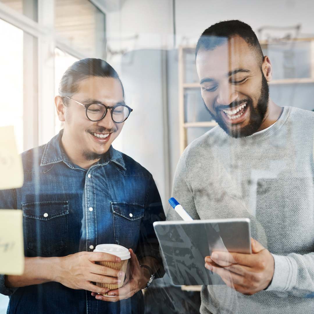 two guys looking at company data