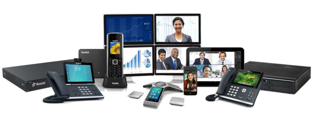 Yealink business phone system with desk phones, cordless handsets, conference phone and video conferencing displays for centralised device management.