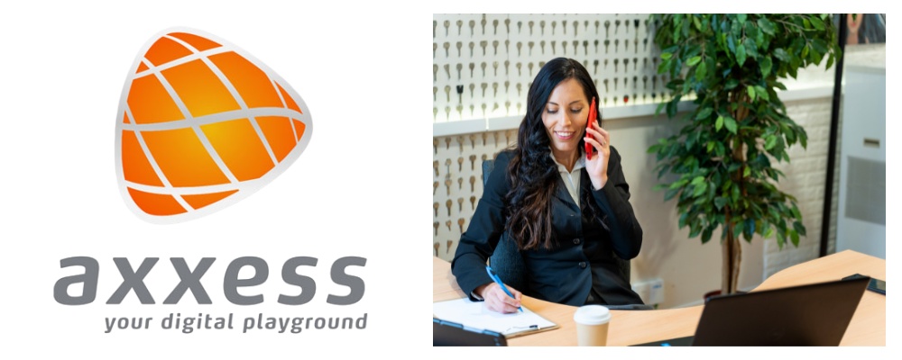 Axxess logo on left and businesswoman in black suit jacket seated and taking a call while writing notes on right handside