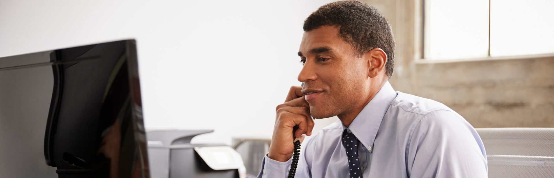 businessman making phone call using used phone system