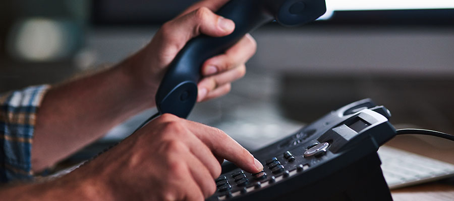 employee dialing number using desk phone
