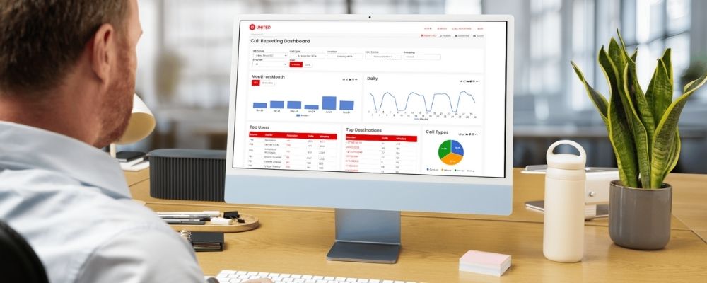 A business manager looking at and customising his Cloud PBX dashboard