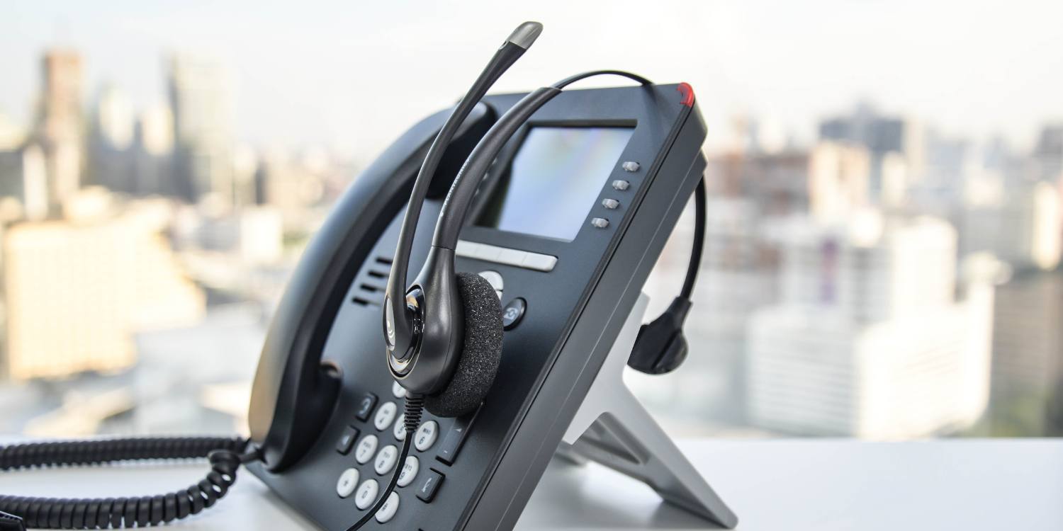 IP deskphone and headset connected to hosted PBX