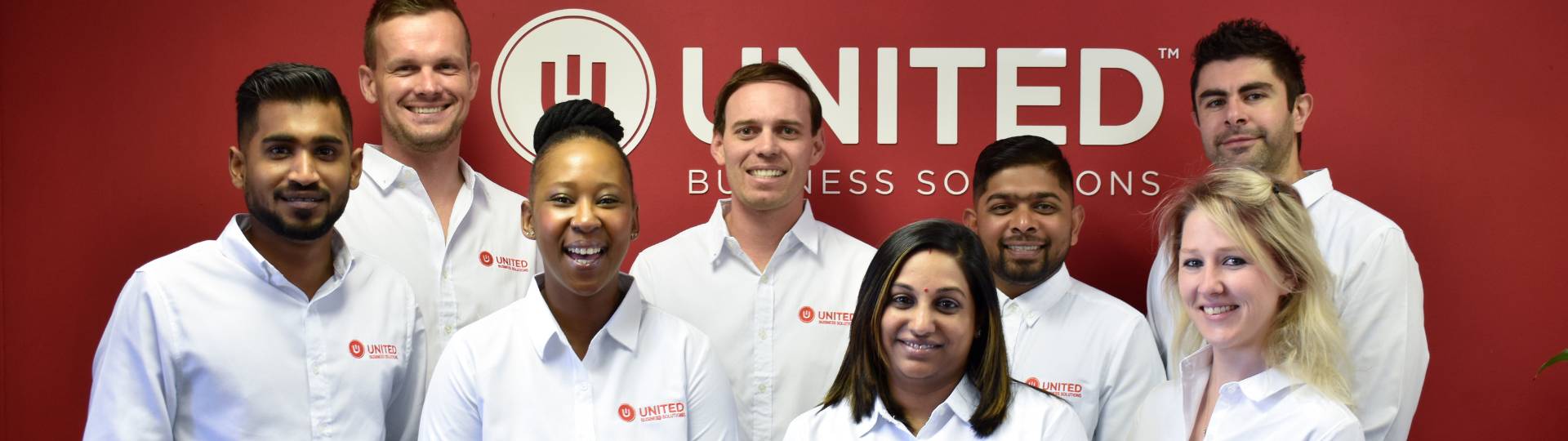 united telecoms team photograph of 8 employees at premises