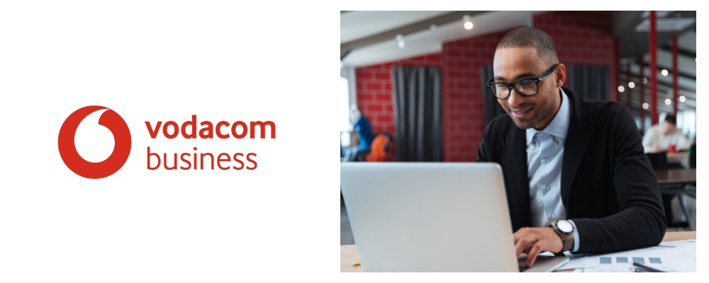 A business manager working on his laptop using Vodacom business fibre