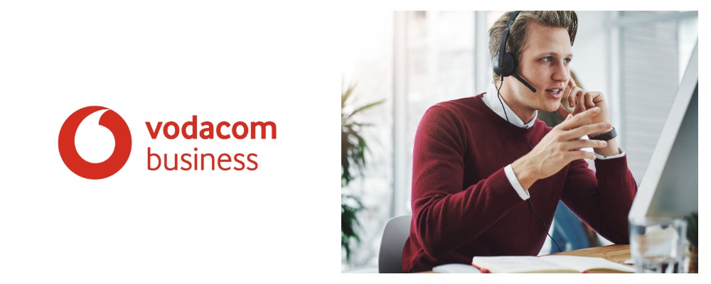 Vodacom business fibre consultant wearing red sweater and using headset