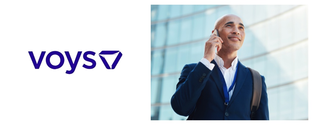 Voys logo on left and businessman in navy suit taking a mobile call on righthandside