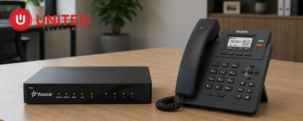 A Yeastar p520 pbx unit and a Yealink VoIP deskphone on a table.